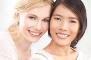 Two beautiful women show off their eyes - Rejuvenate your eyes at Elan Medical Skin Clinics in central London and Essex